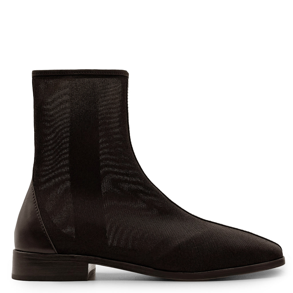 Side studio shot of Daniella Shevel Aliza Mesh Bootie in brown, highlighting sleek mesh texture and ankle-length design.