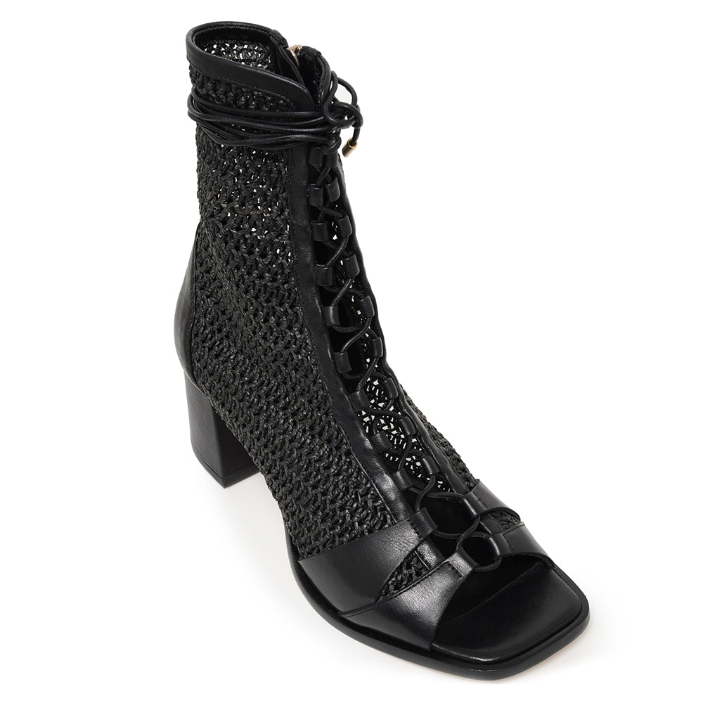 Daniella-Shevel-Frida-Open-Toe-Bootie-In-soft-raffia-in-black-quarter-view-of-laces