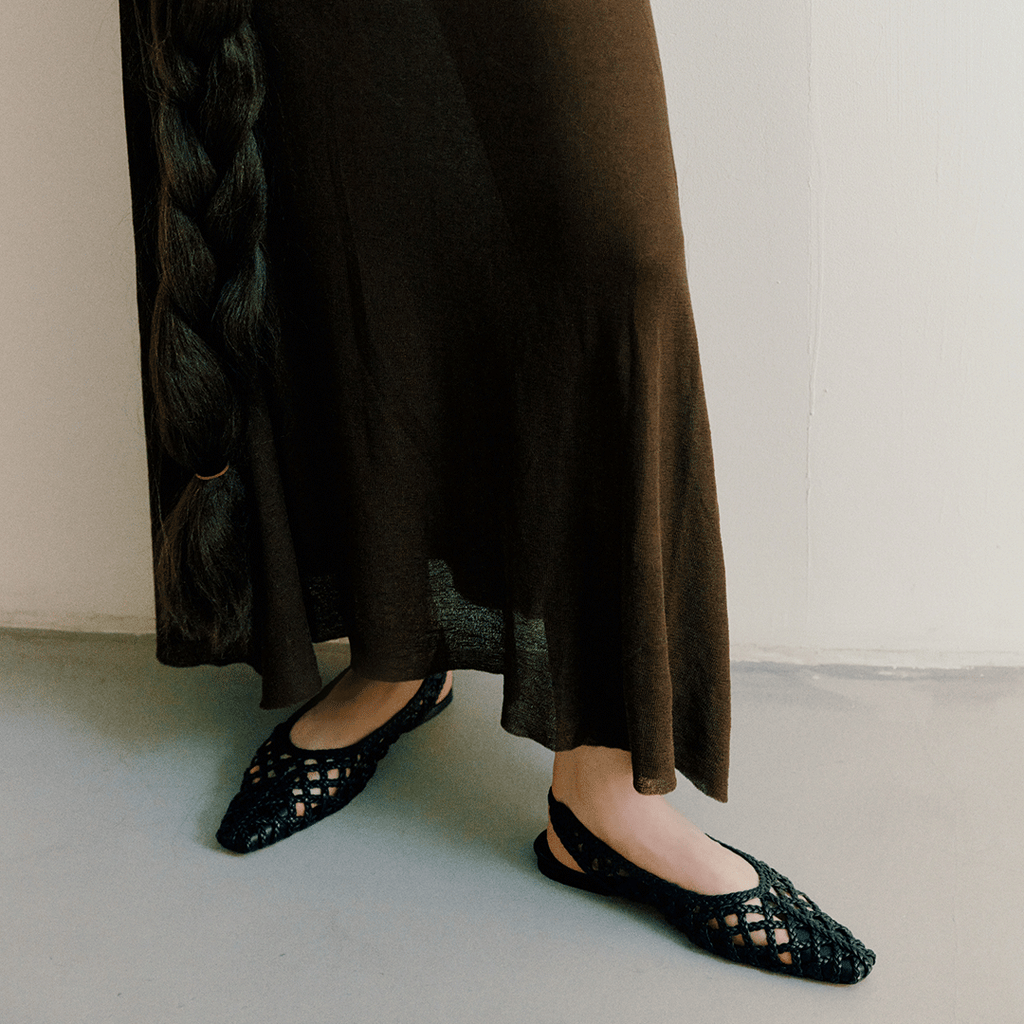 Walking shot of model in Daniella Shevel Halo Black flats – capturing movement and everyday wearability with elevated style.