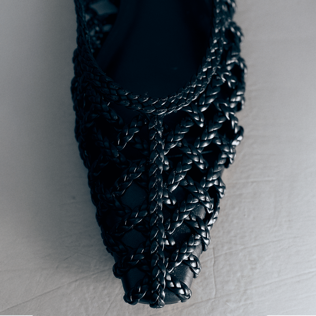 Close-up of the toe box on Halo Black flats – spotlighting luxe handwoven leather and fine craftsmanship.