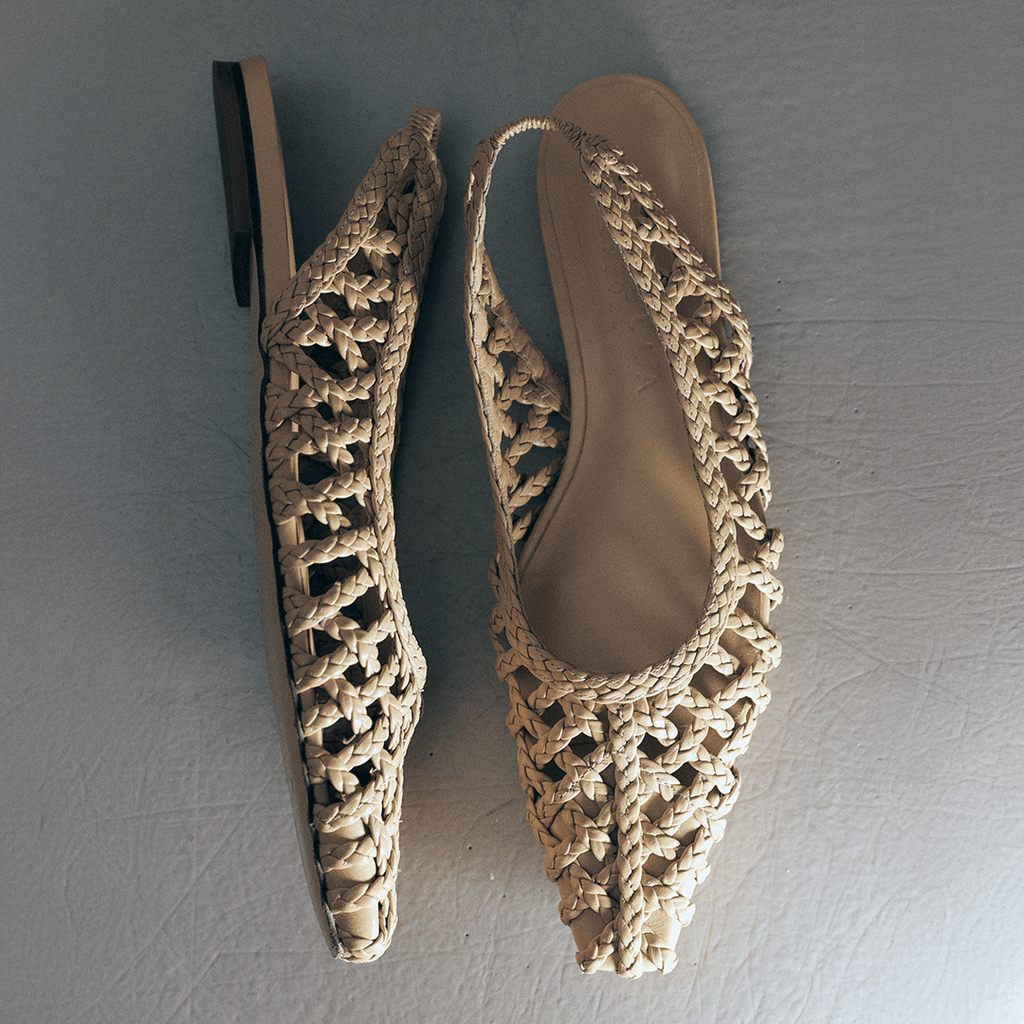 Flat lay of Daniella Shevel Halo Soft Oat flats – pair positioned toe-to-toe to showcase handwoven leather detail.