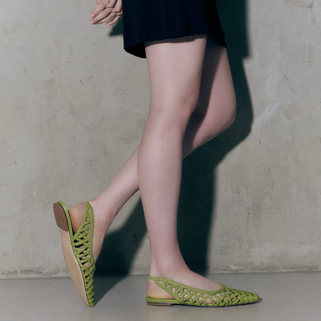 Side profile of Halo flat in Wild Moss – studio shot emphasizing the chic pointed toe and natural green tone.