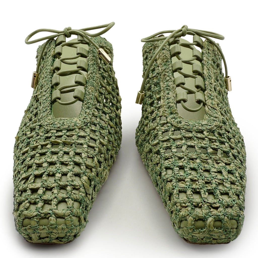 Studio shot of Daniella Shevel Lina Heel Mule in Green Moss – front view highlighting pointed woven silhouette and tonal lace-up detailing.