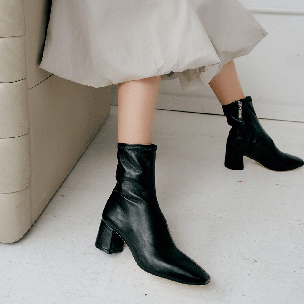 Daniella Shevel Milani Stretch Bootie in Black with grey dress