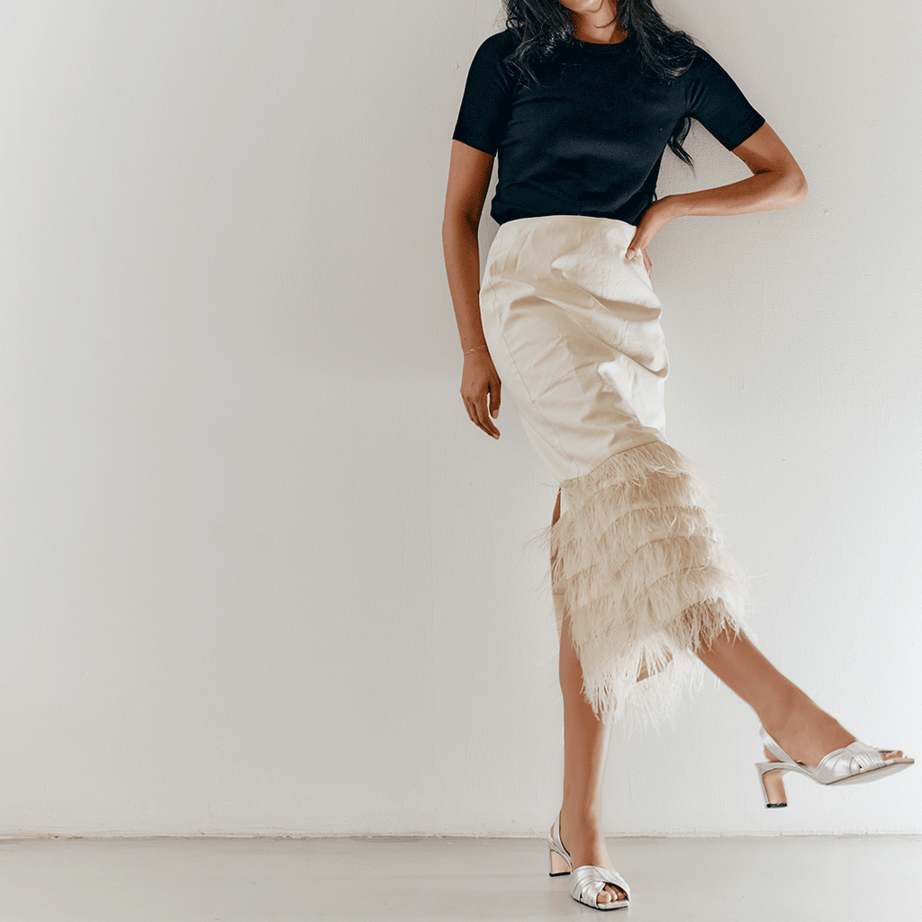 Skirt paired with Riley Leather Low-Heel in metallic silver for polished styling.