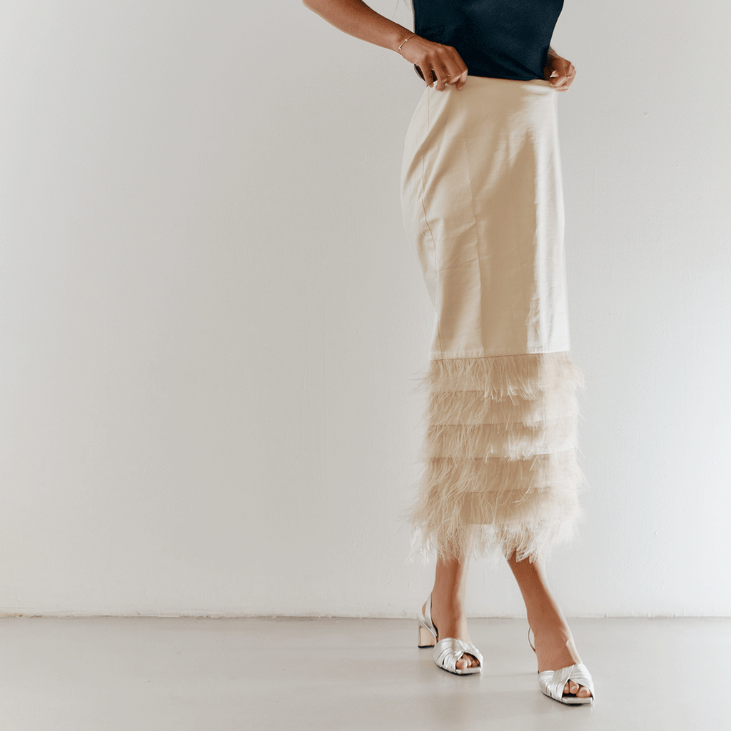 Walking capture of Riley Leather Low-Heel in silver styled chic.