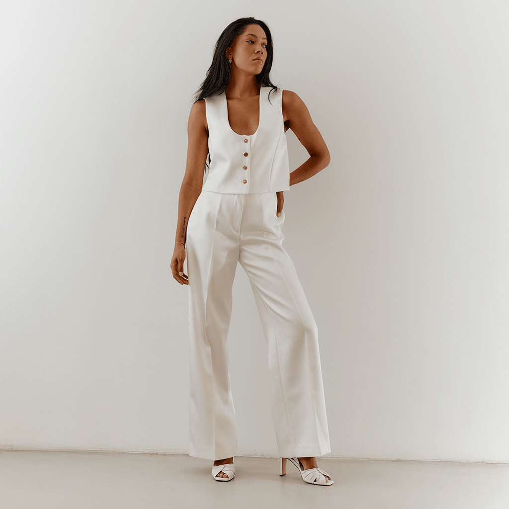 White Skyler slingbacks styled with monochrome outfit, lifestyle angle.