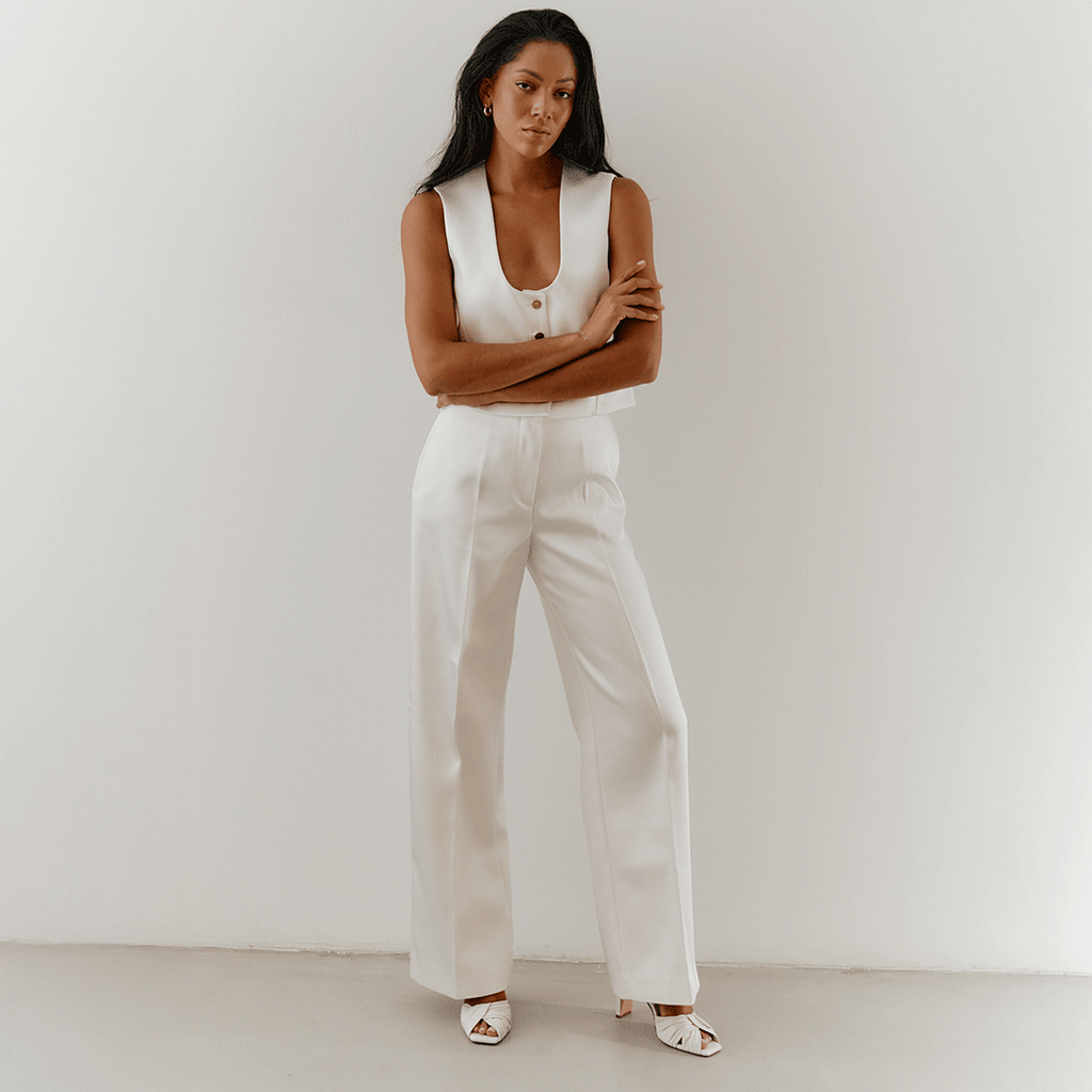 Minimal studio look of Riley white sandals styled with casual chic outfit.