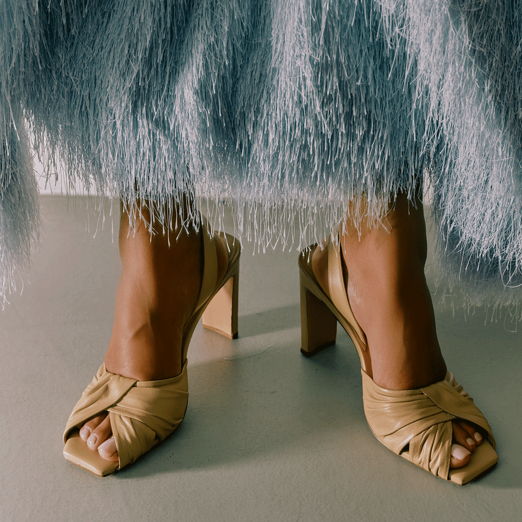 Daniella Shevel Skyler soft oat high-heel styled with textured skirt.