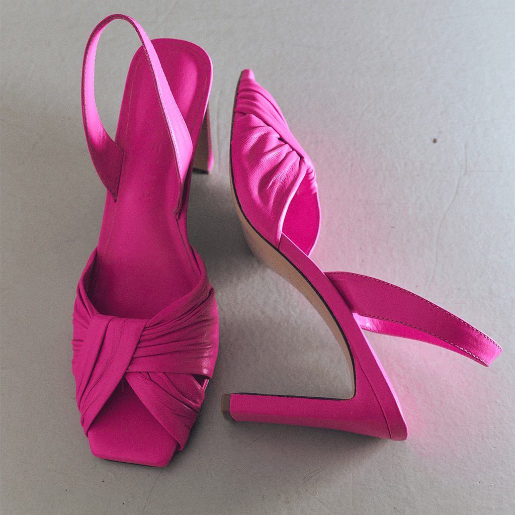 Studio product angle of Skyler high-heel in intense pink, front view.