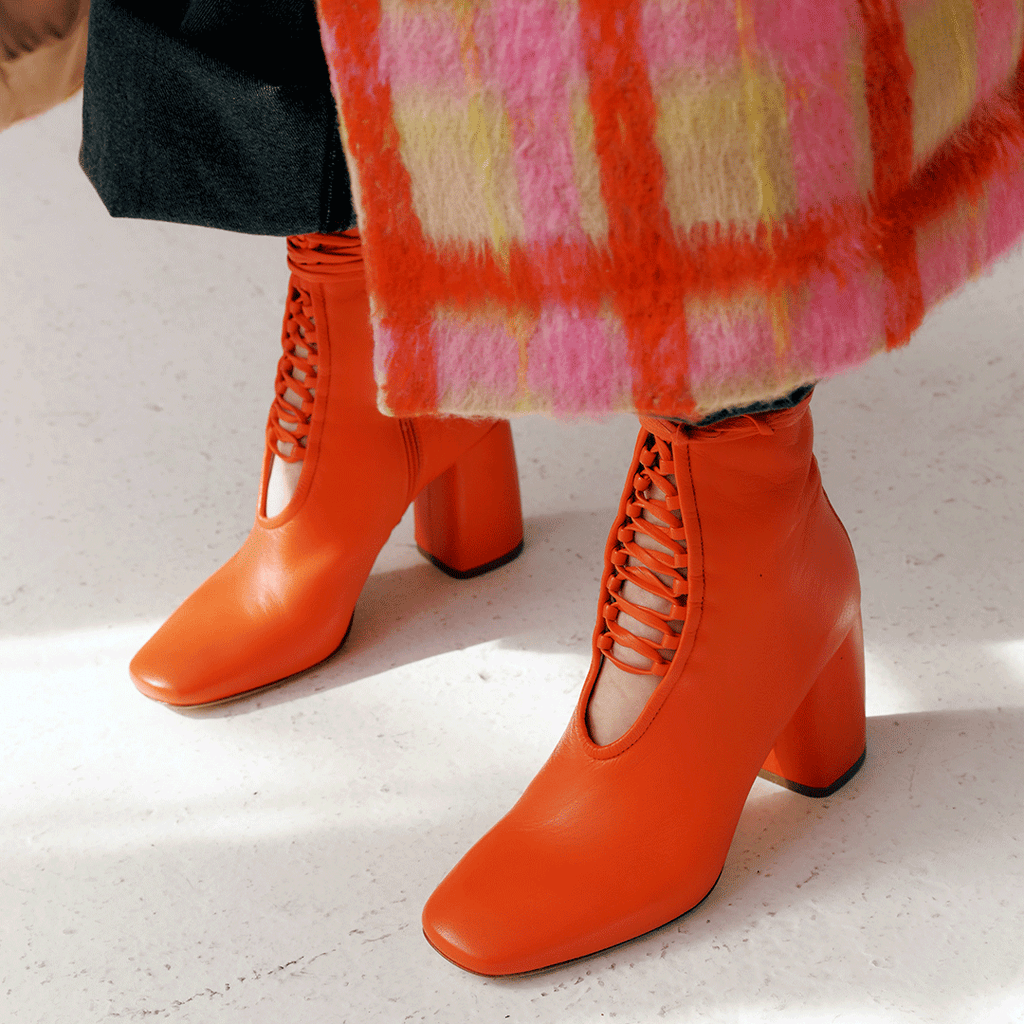 Daniella Shevel Belladonna Lace up boot in lobster red with statement coat 