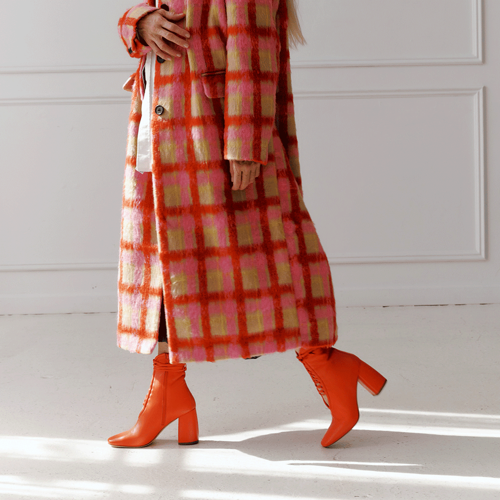 Daniella Shevel Belladonna Lace up boot in lobster red side walking view