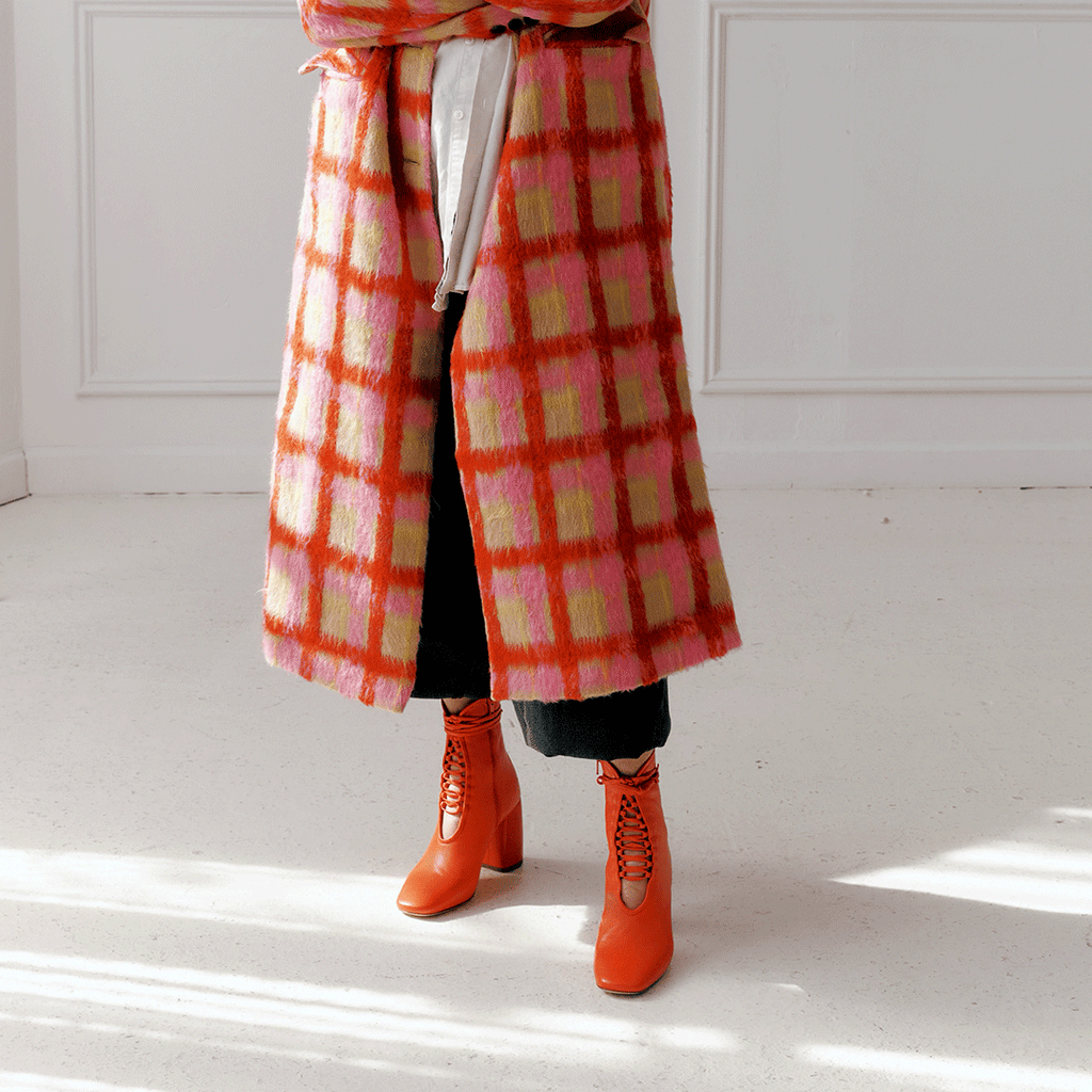 Daniella Shevel Belladonna Lace up boot in lobster red styled in a fall jacket