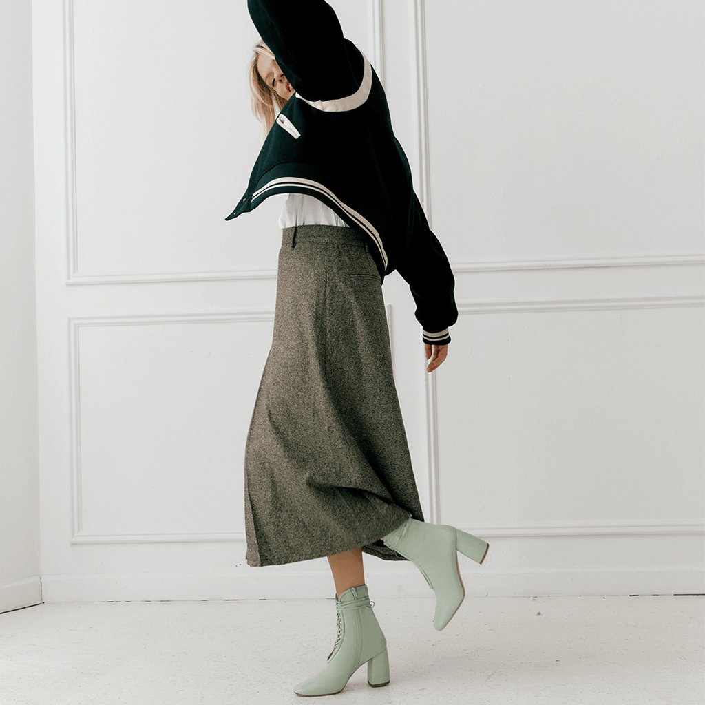 Daniella Shevel Belladonna Mint Green Lace Up Boot styled in green bomber jacket and brown midi skirt 