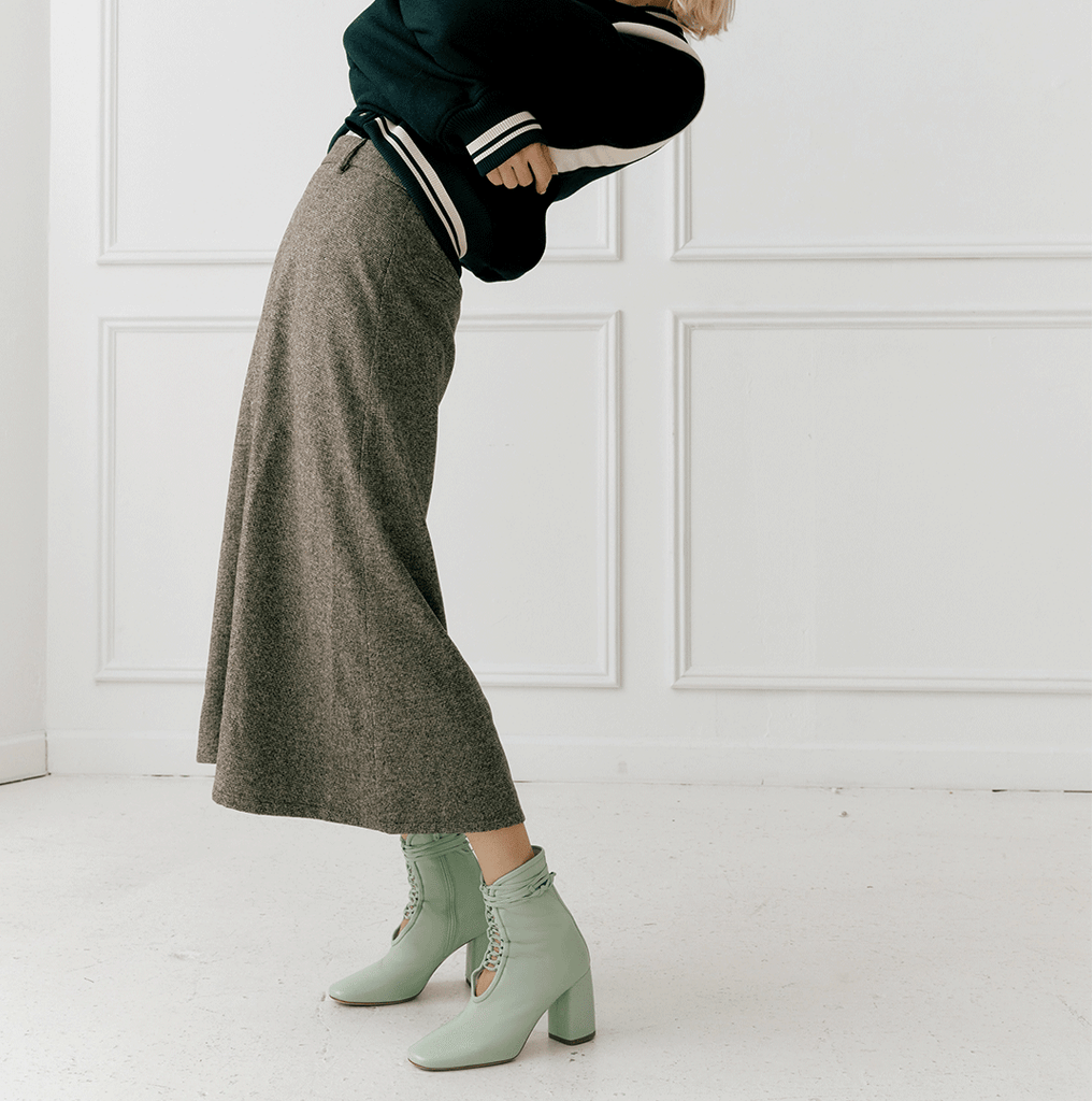 Daniella Shevel Belladonna Mint Green Lace Up Boot styled in bomber jacket and midi skirt