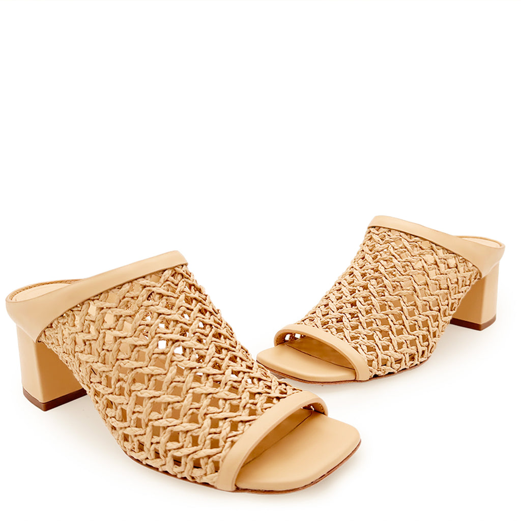 Daniella Shevel Sienna Slide sandals in camel and coral, presented as a pair to showcase craftsmanship, breathable woven leather, and luxurious finish.