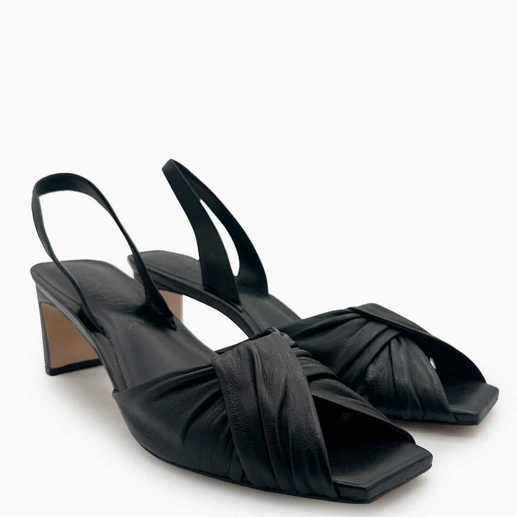 Overhead pair shot of Riley Leather Low-Heel in black highlighting soft leather.