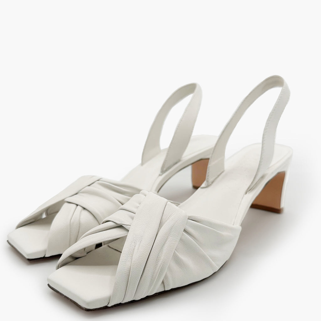 Overhead side view of Riley Leather Low-Heel in white leather with low heel.