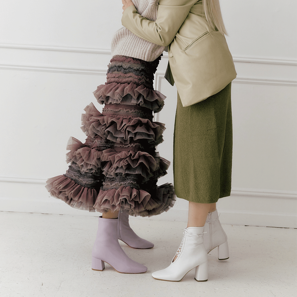 Daniella Shevel Belladonna Lace up boot in white and Purple Milani in midi skirt and dress