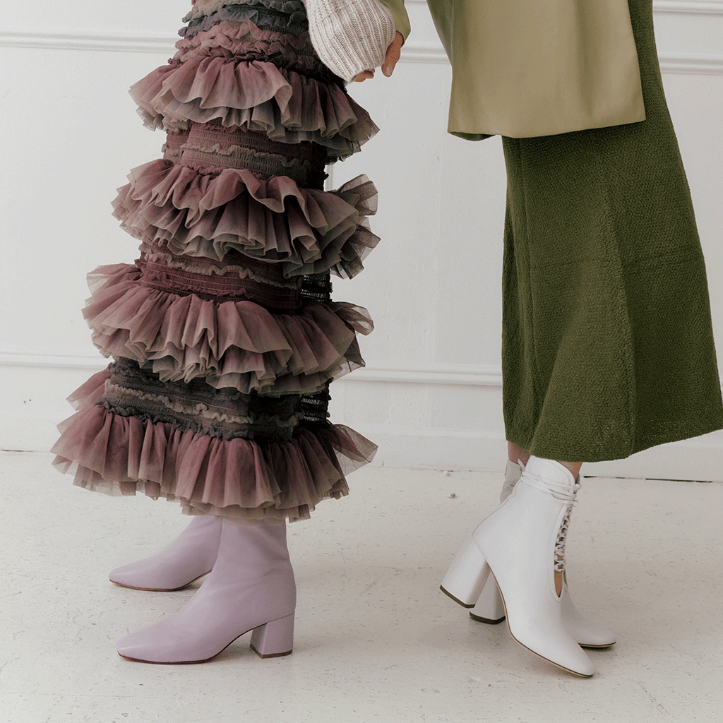 Daniella Shevel Belladonna Lace up boot in white and Purple Milani in midi skirt and dress