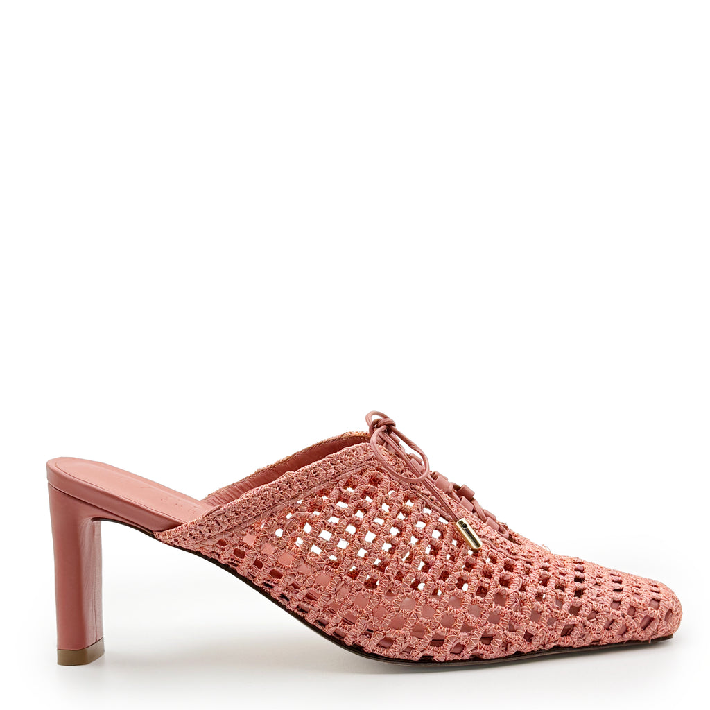 Daniella Shevel Bruna woven heel in Berry Petal, crafted with a handwoven raffia upper and sculpted pink heel for an elegant yet breathable summer mule.