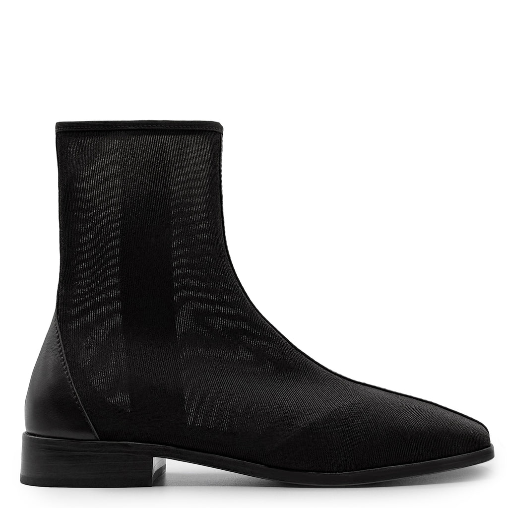 Side studio view of Daniella Shevel Aliza Mesh Bootie in black, crafted with breathable mesh for an elevated everyday ankle boot.