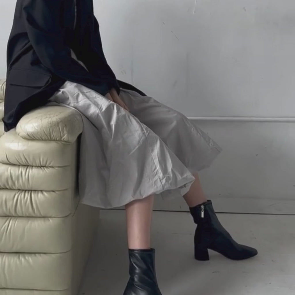 Daniella Shevel Milani Leather Bootie Styled in grey midi dress