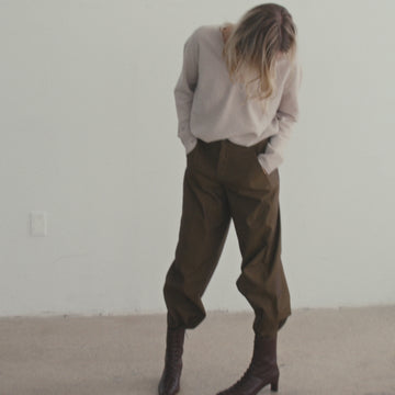 Daniella-Shevel Maeve Boot Lace Up Details styled in pants and a sweater
