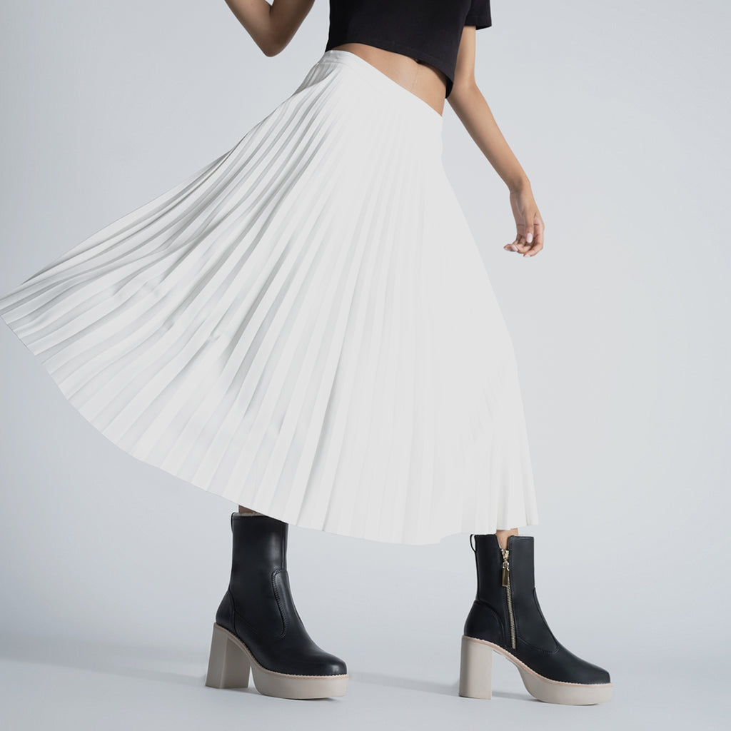 Daniella Shevel Aspen Shearling Boot in black waterproof and weatherproof with rubber lugg sole with proenza skirt