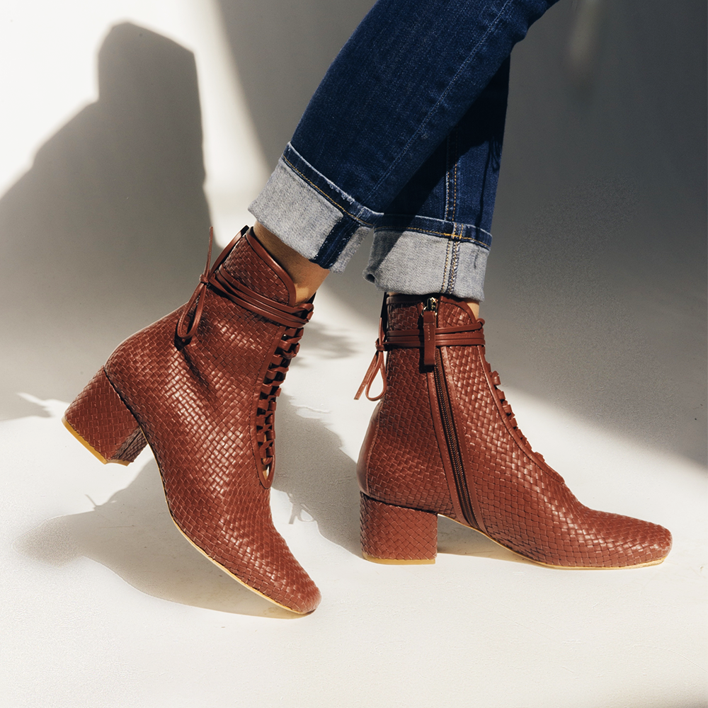 Daniella Shevel Woven Kamari lace up Brown boot close up with blue denim