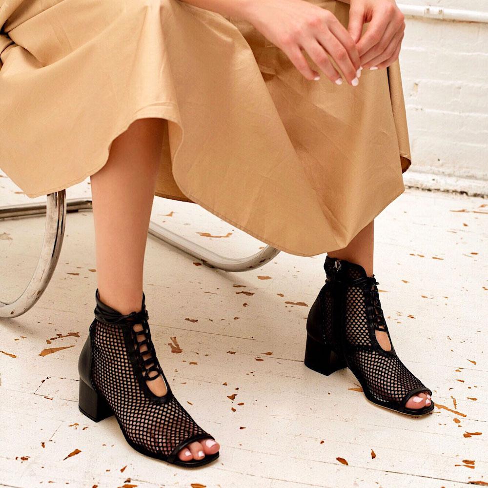 Daniella Shevel Nola Mesh Low heel Open Toe Bootie on model with cream Dress