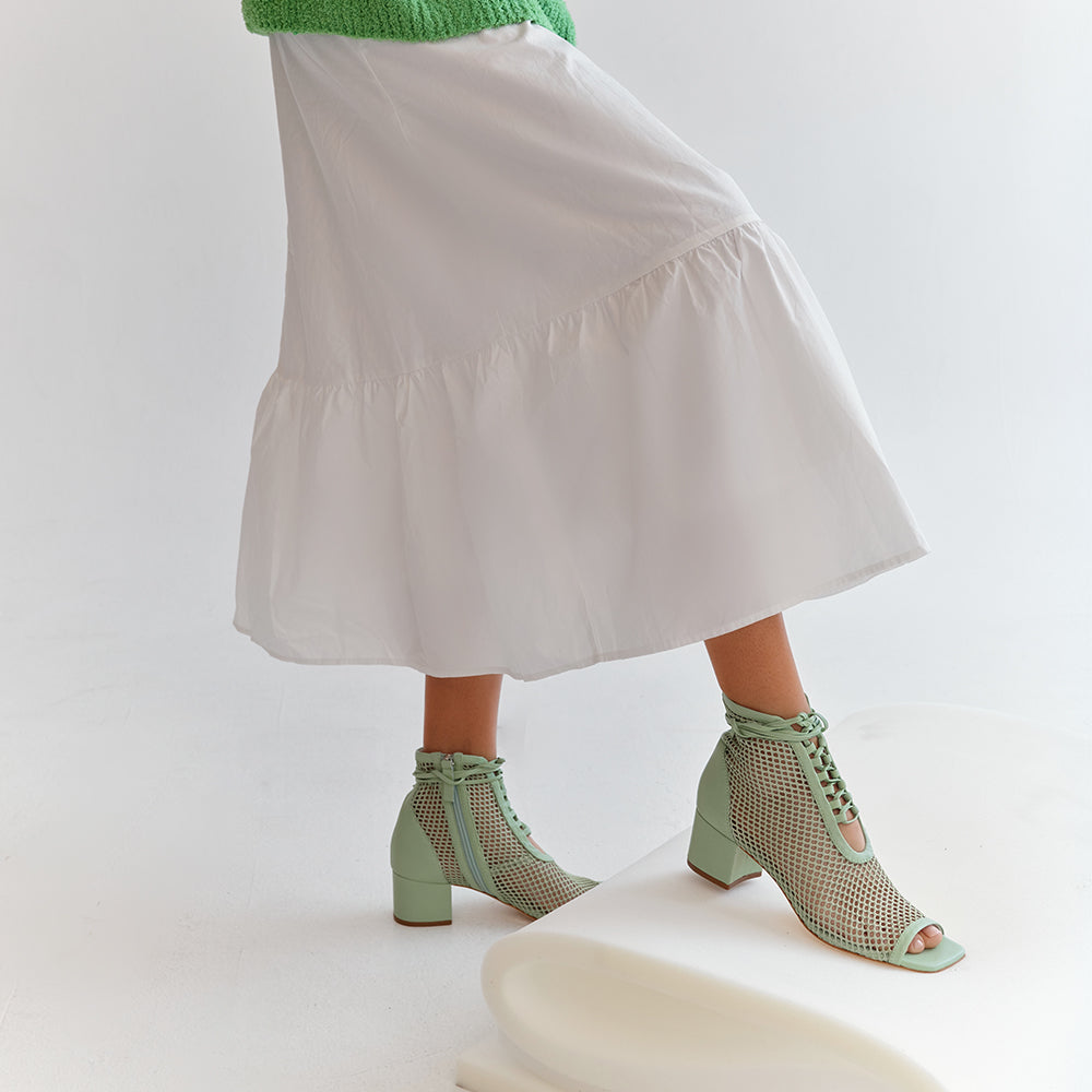 Daniella Shevel Mint Nola Mesh Bootie with white dress and green sweater