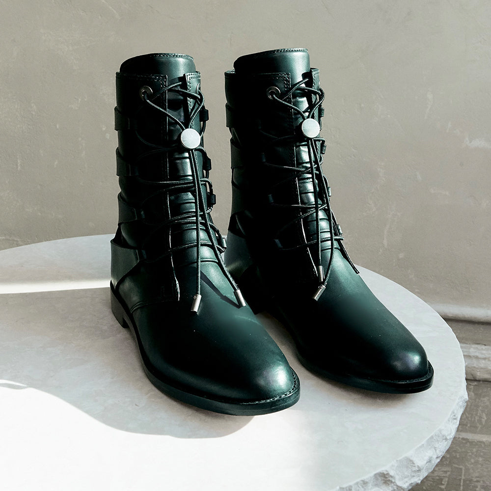 Daniella Shevel black moss boot on marble table