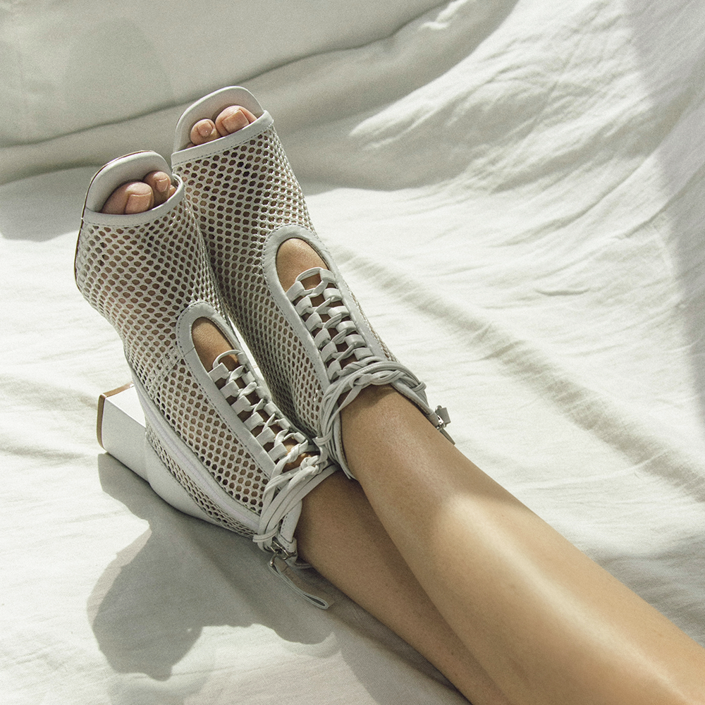 Daniella Shevel Nola Mesh White Bootie on sofa
